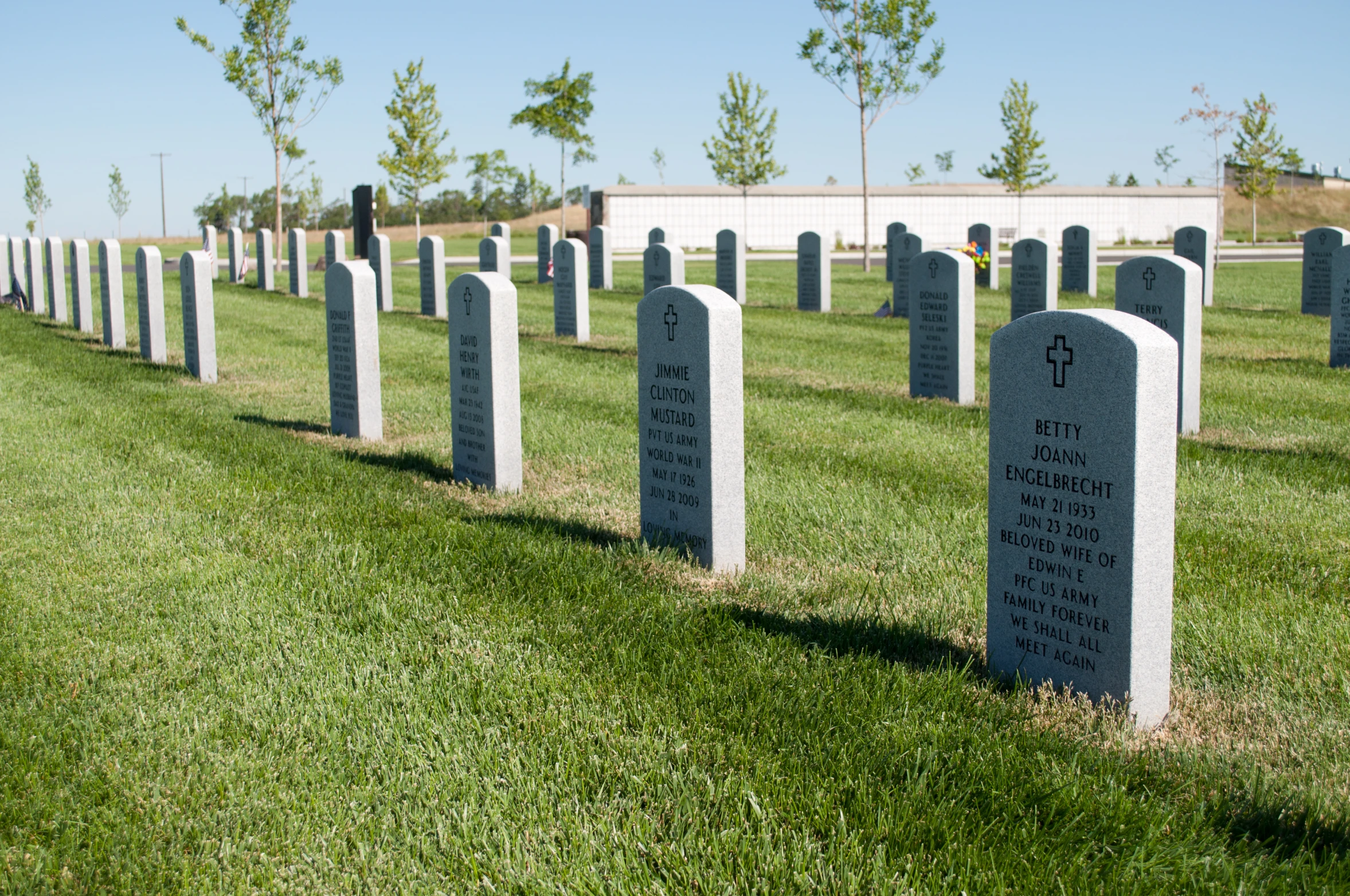 the headstones of all of the graves in a row