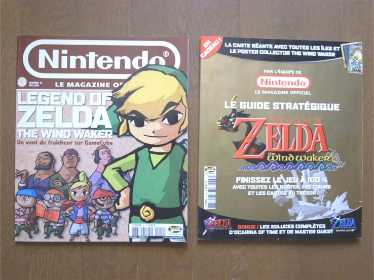 two nintendo magazines next to each other on the table