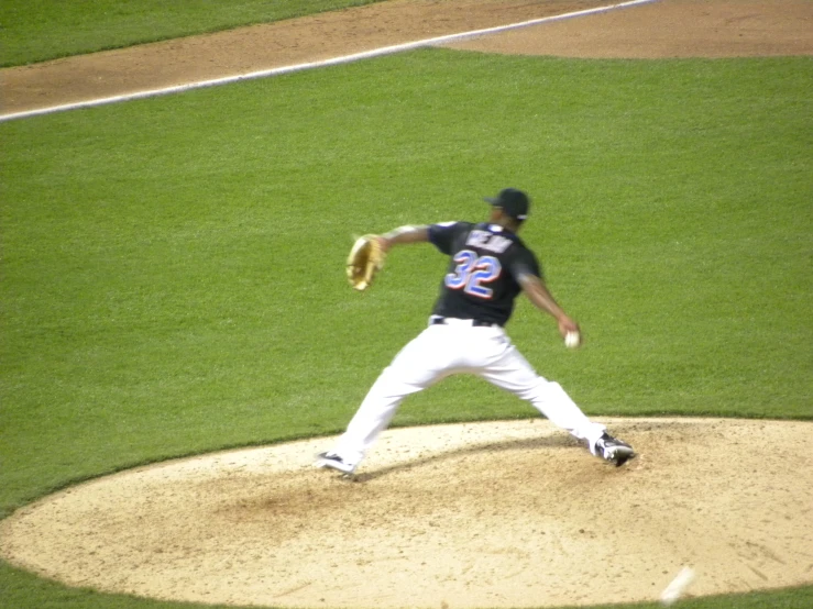 a man throwing a baseball from the mound