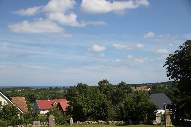 a countryside view with lots of trees and houses