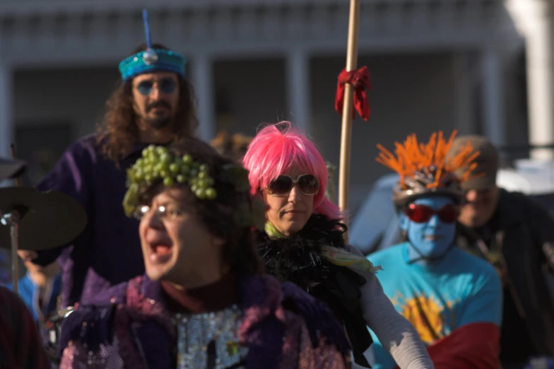 people in colorful costumes on a sunny day