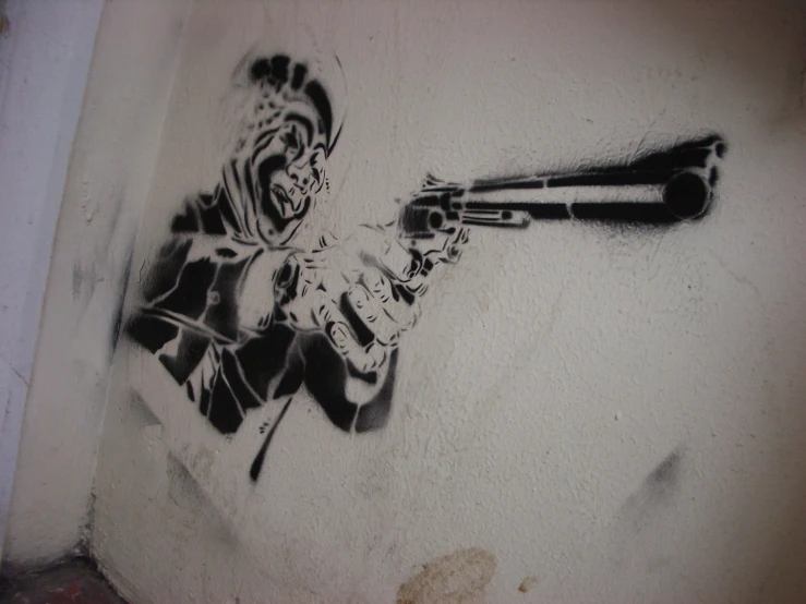 the painting is a man holding a gun, and wearing hoods
