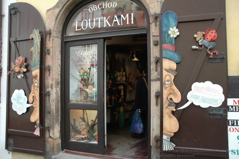 the entrance to a store with some stuffed animals on display