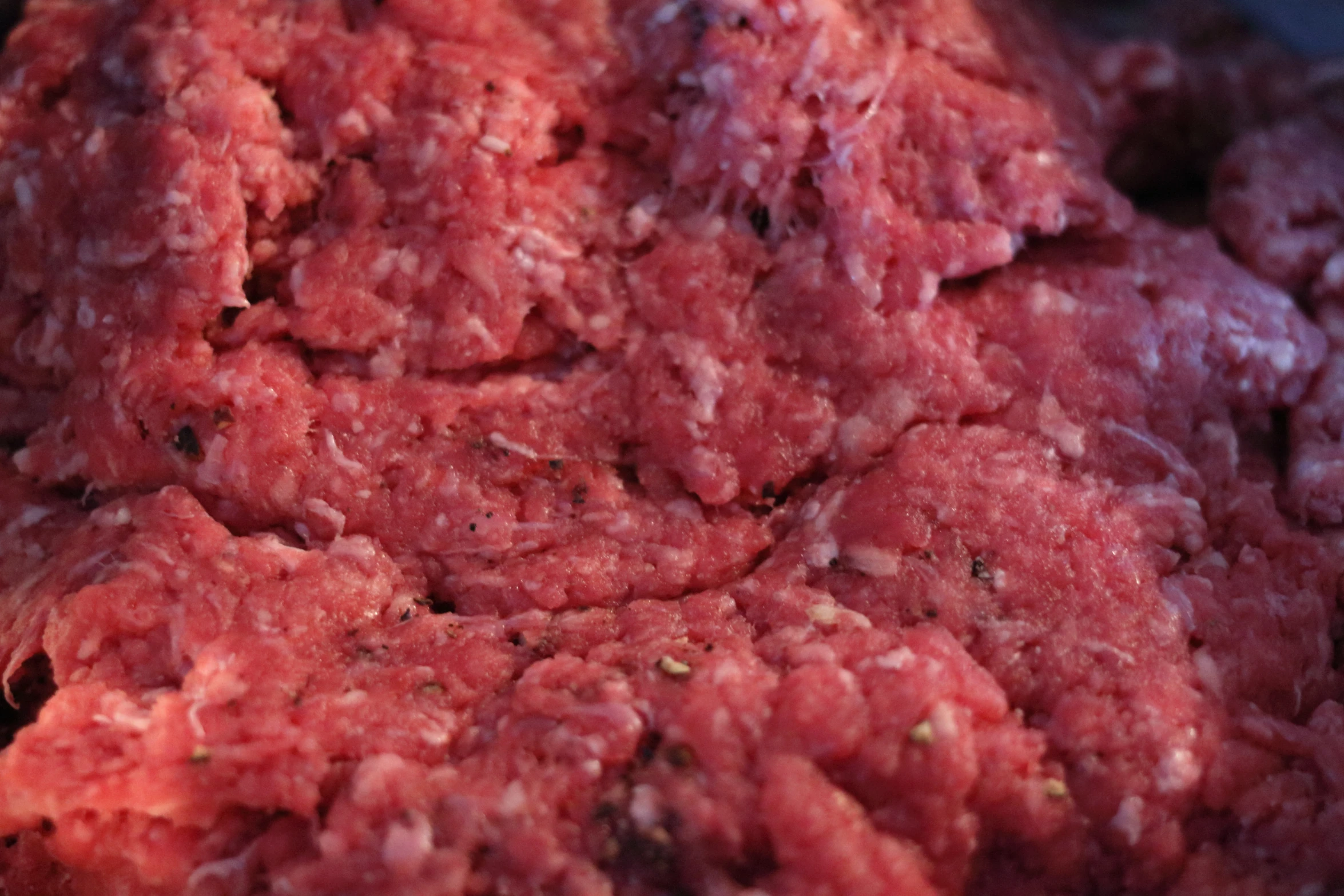 a close up of meat chunks on top of soing purple