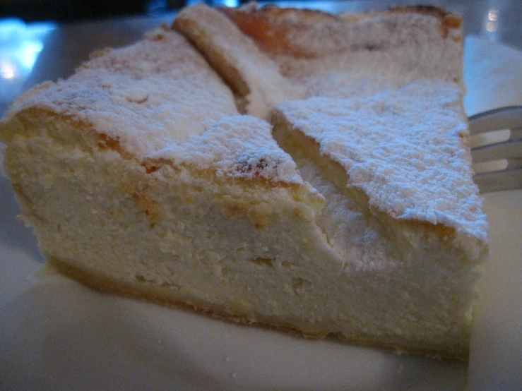 an individual's piece of cake with white frosting