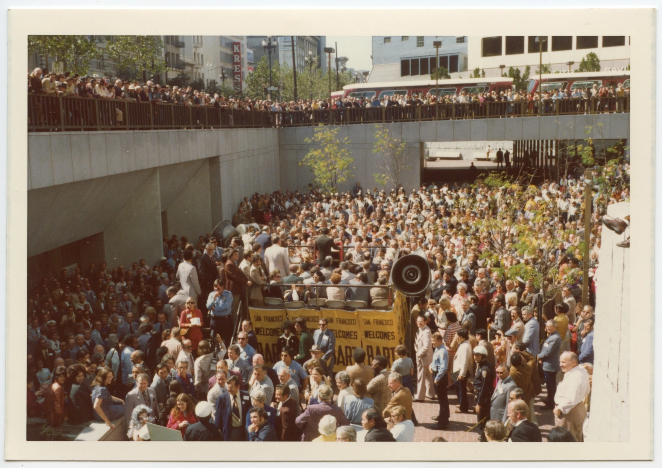 there is a large crowd watching a man on a stage