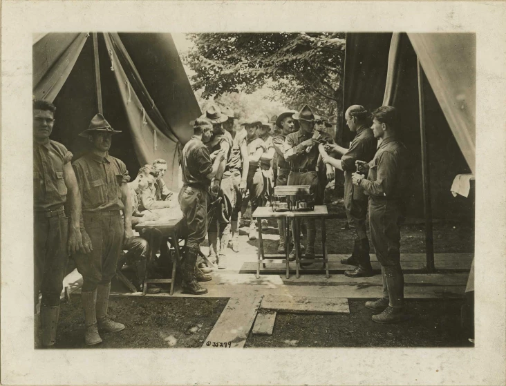 old black and white pograph with people sitting at tables