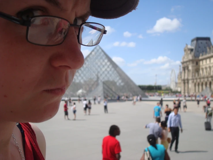 people are walking around in front of the egyptian pyramid