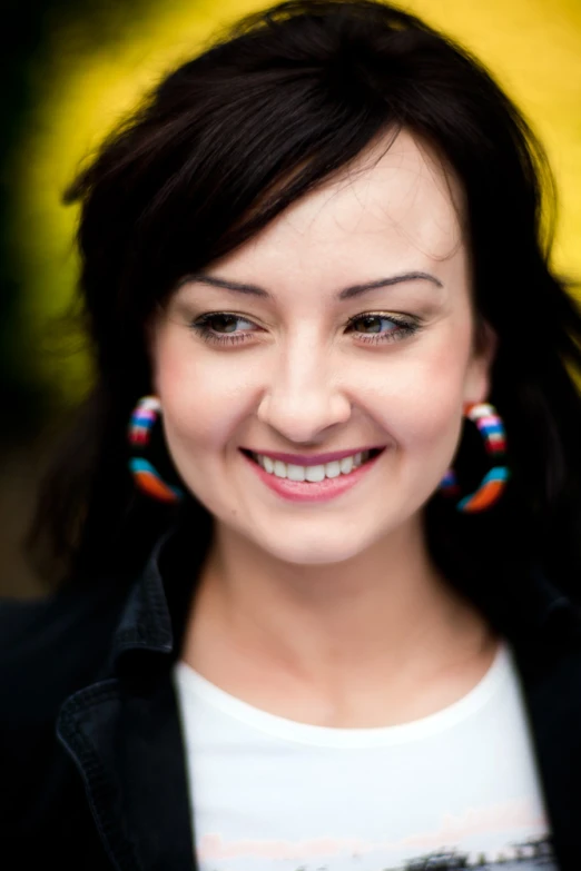 a girl with a very long dark hair smiles for the camera