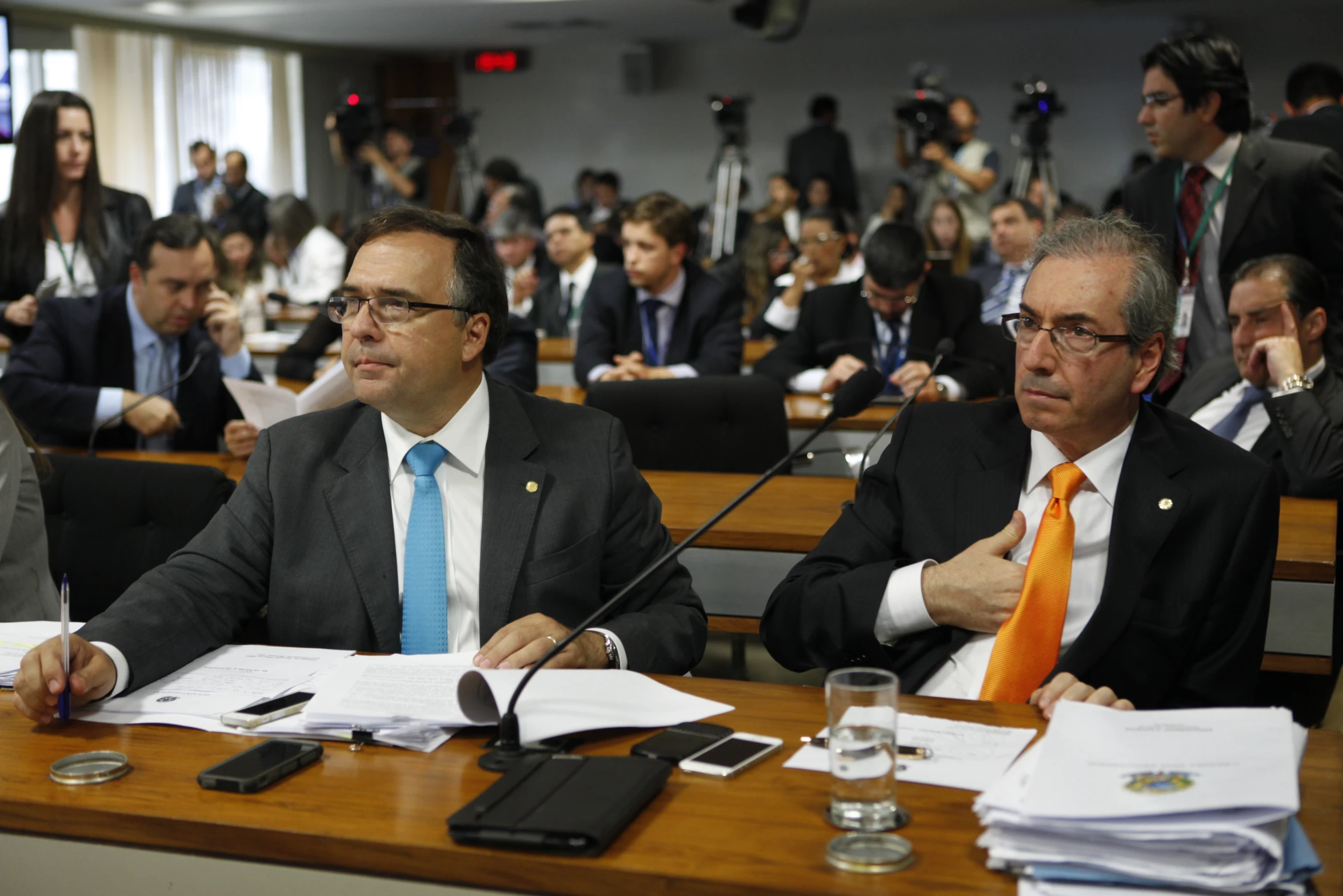 a group of people sitting in an empty room