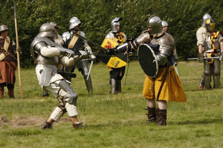 men in medieval armor and helmets at a game