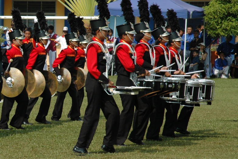 a parade with drum players and drummers in uniform