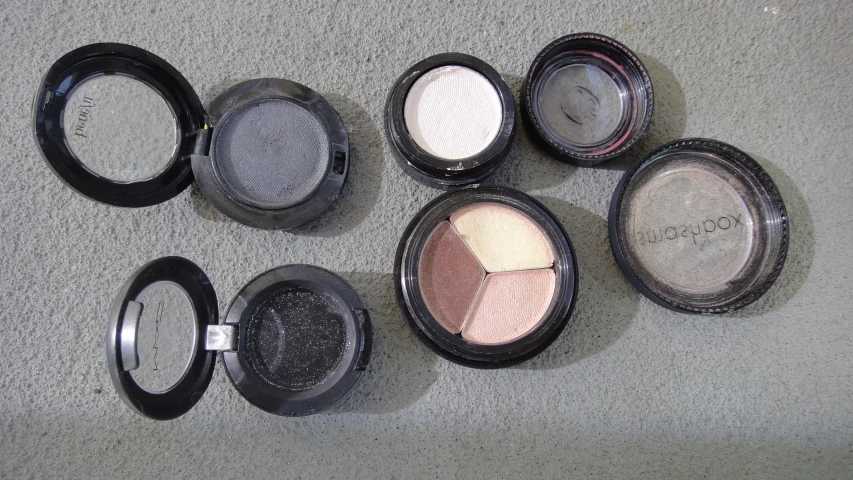 a collection of eye products arranged on top of each other