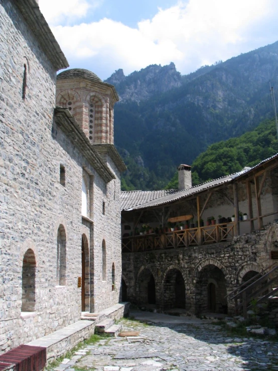 the back side of a building in the mountains