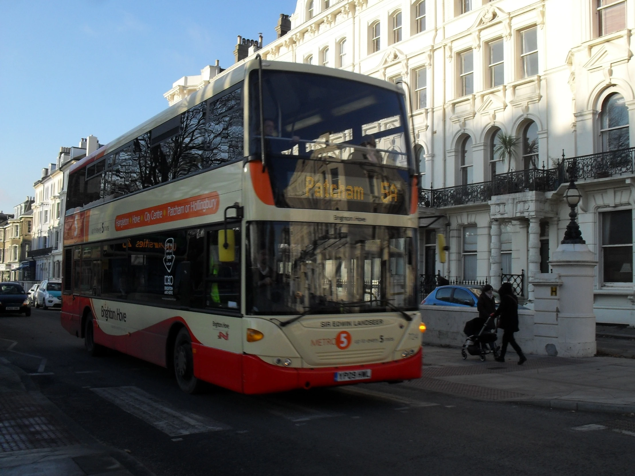 the city bus is pulled over on the side of the road