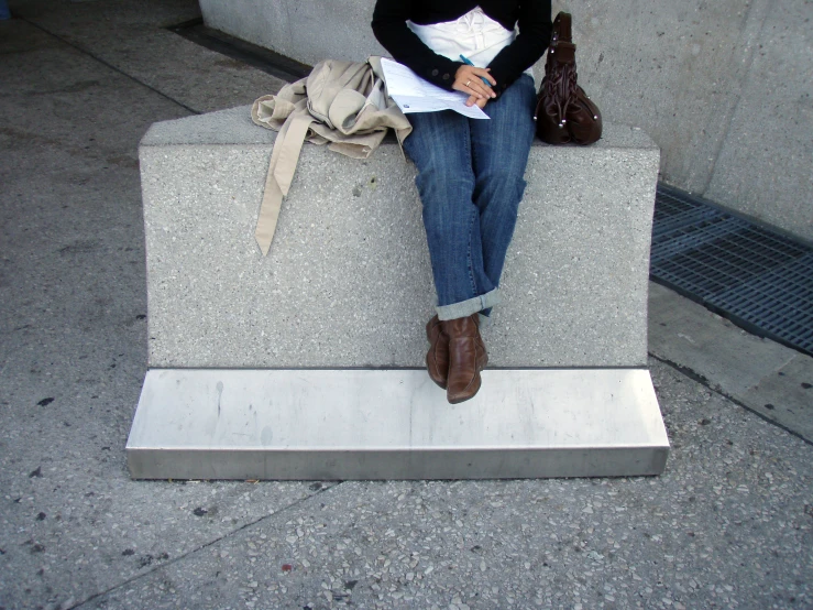 there is a woman that is sitting on a monument