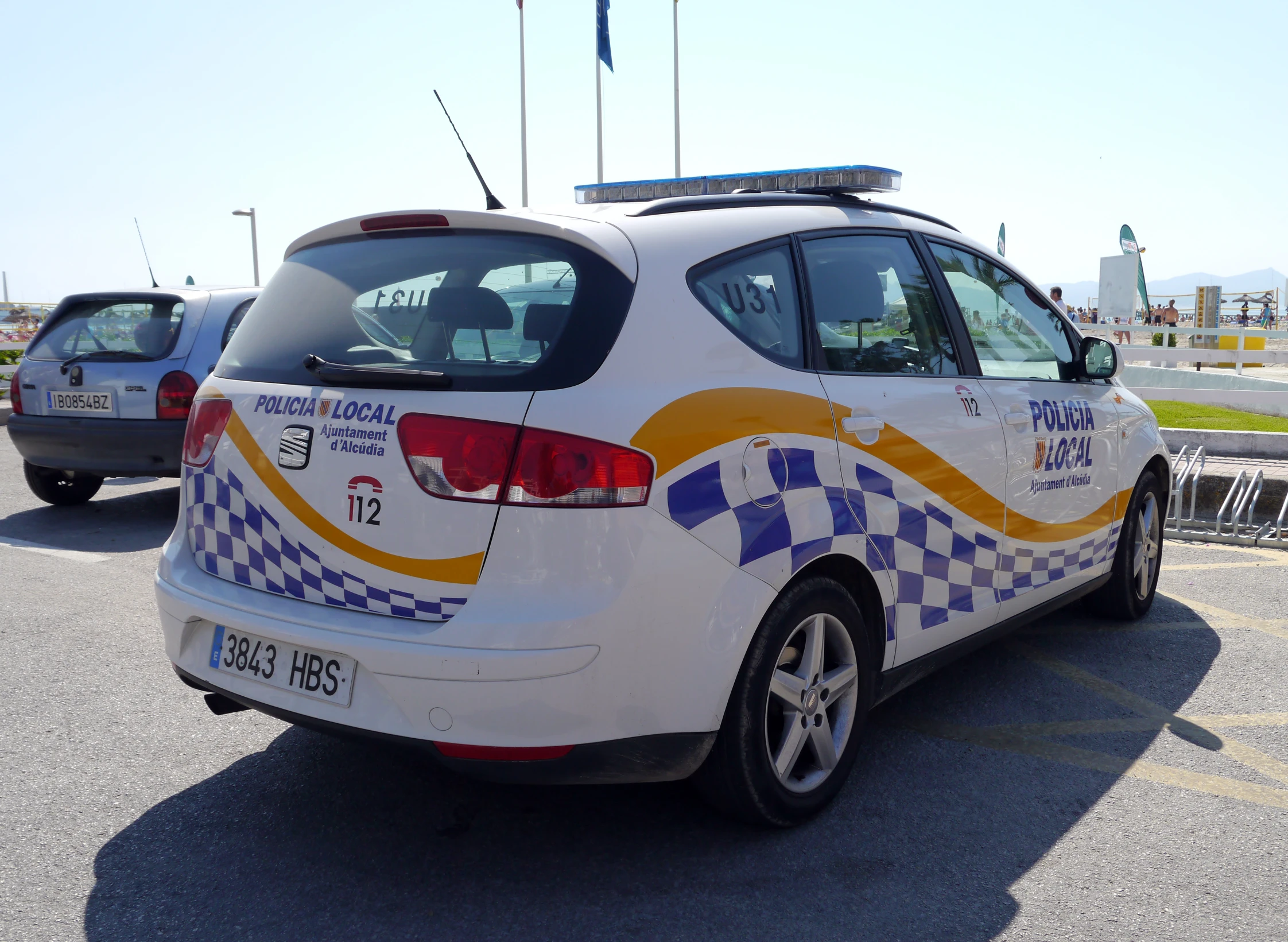 an unusual car has a checkered design on the side