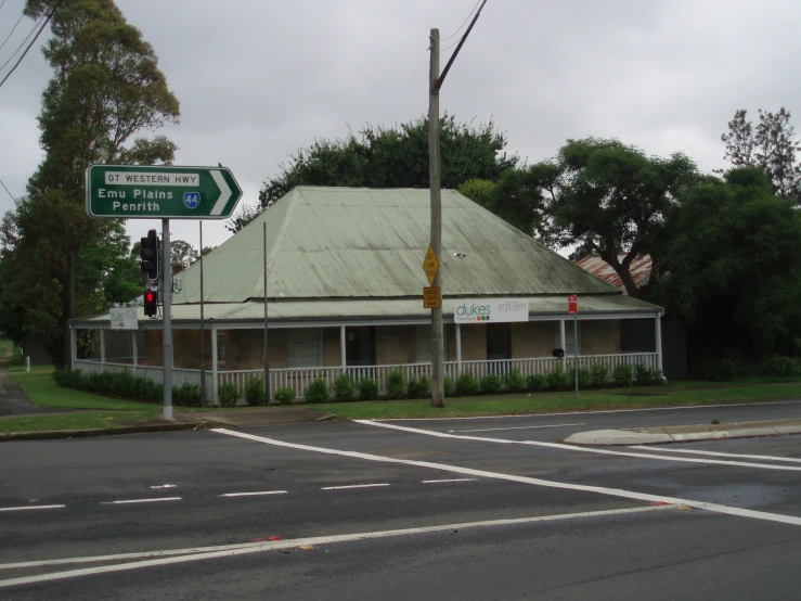 there is an intersection with a cross street and one green street sign