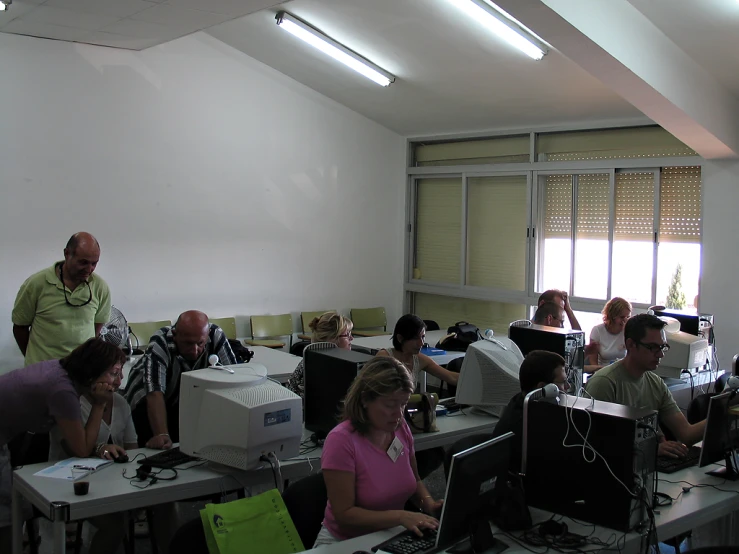 an office filled with people working on computers