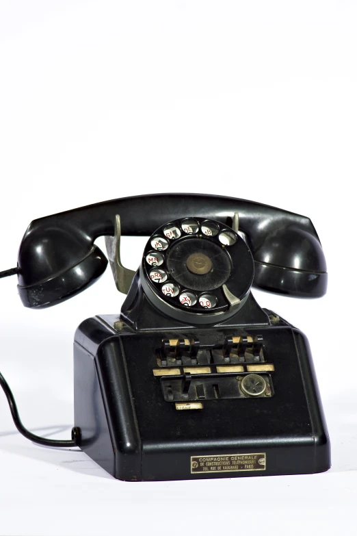 an old - fashioned phone is seen on a white background