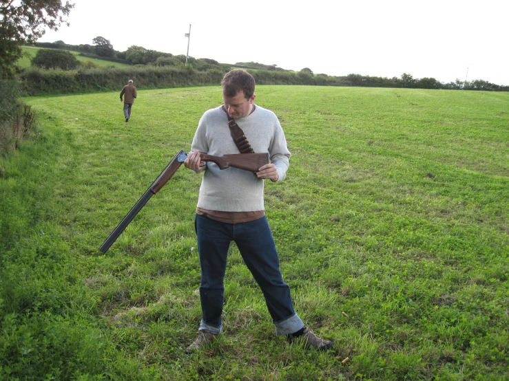 a man holding a huge wooden object in his hands