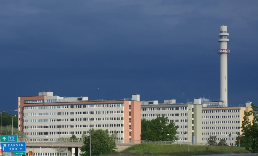 an old factory building and the water tower in the background