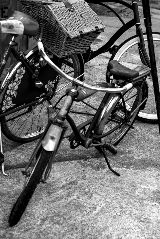 a black and white po of two bikes parked