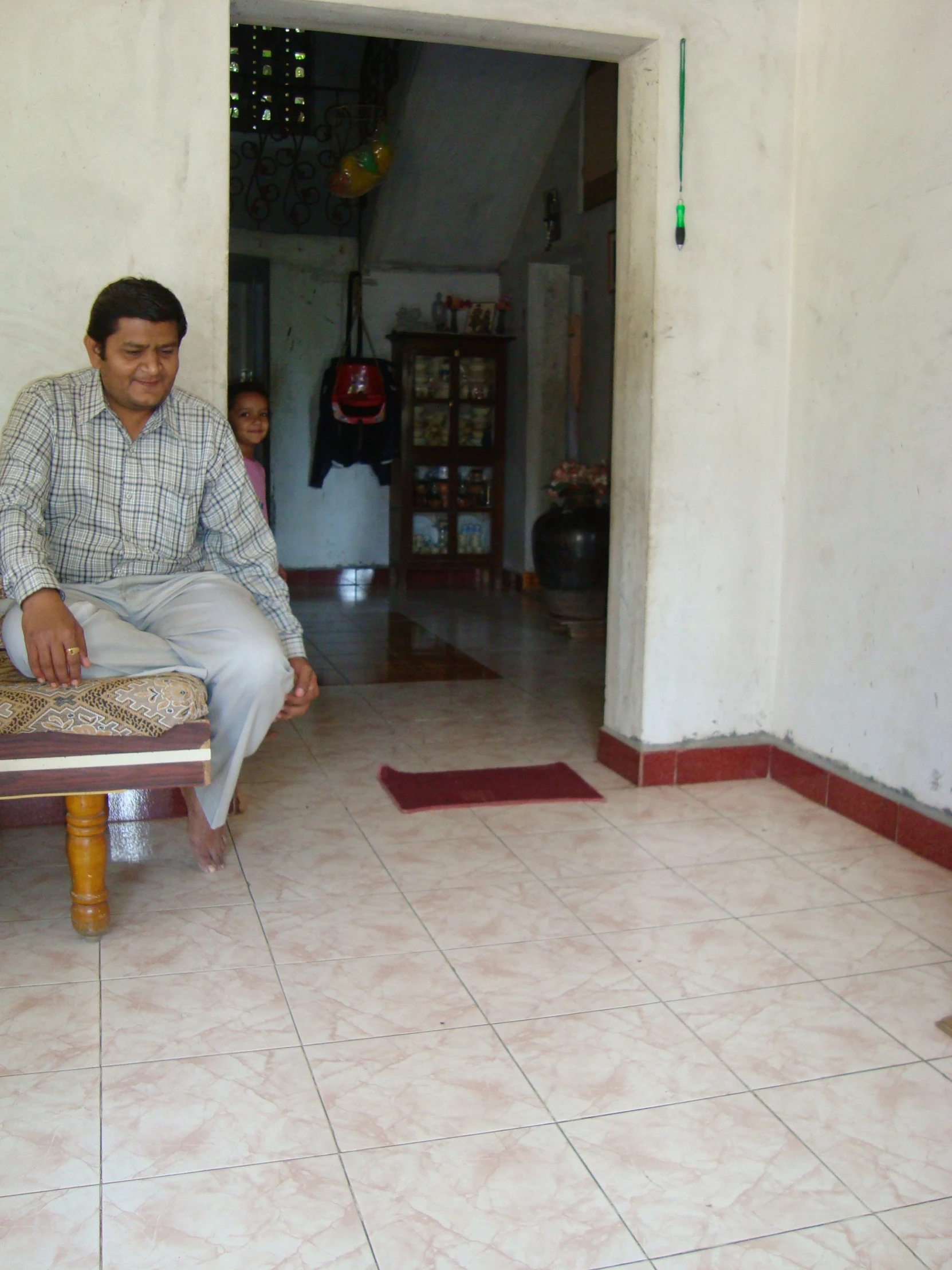 a man sitting on a bench looking around