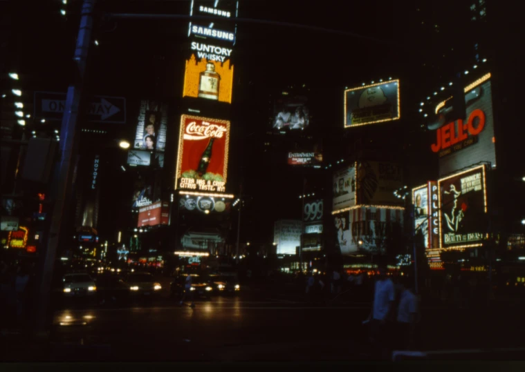 night view of city lights with buildings and neon signs