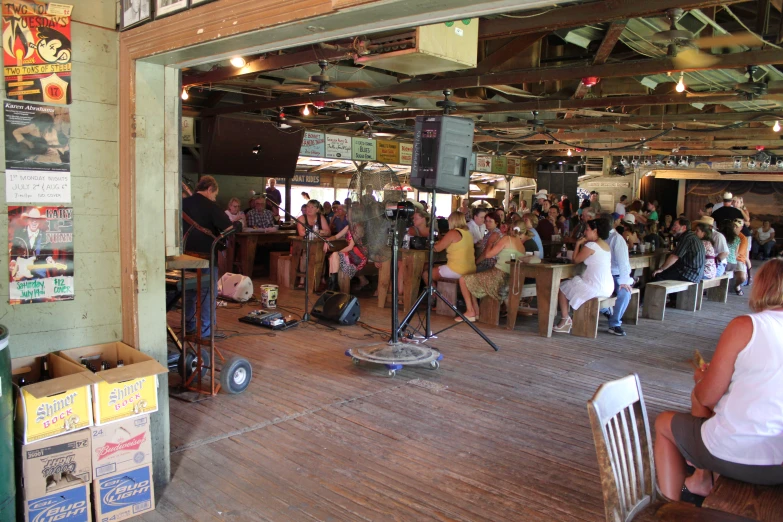 an outdoor concert with people playing instruments and singing