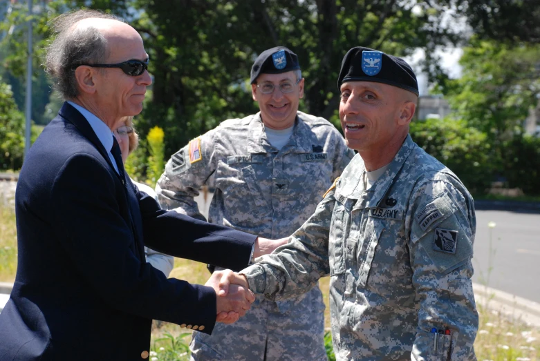 a group of soldiers are meeting in a field