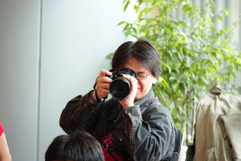 a young man takes a po with his camera