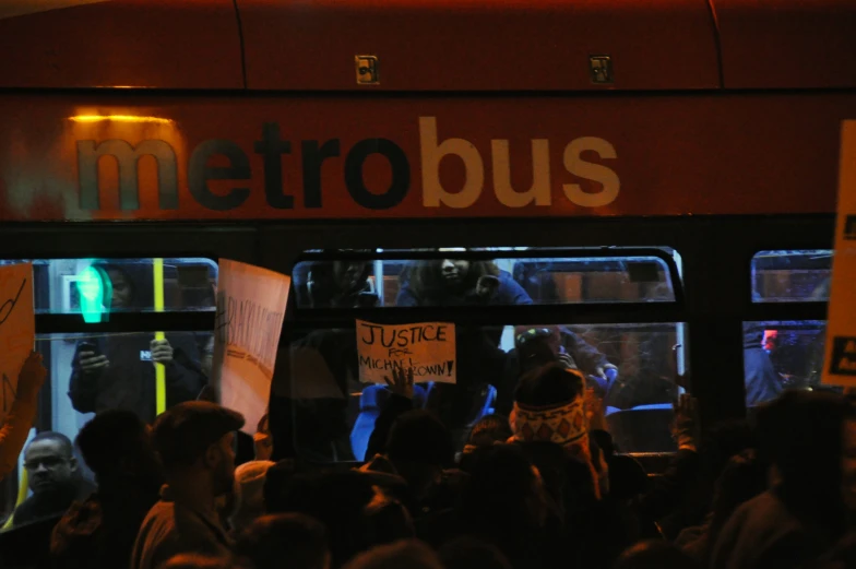 an image of a crowd waiting at bus stop