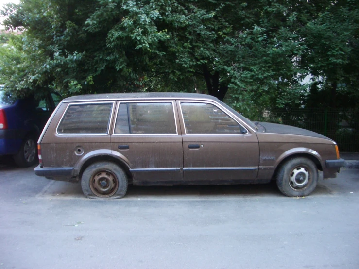 a brown minivan parked in a parking lot