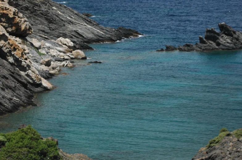 a view from the shore looking over the water