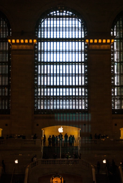 a view inside of a building with lots of windows and people inside