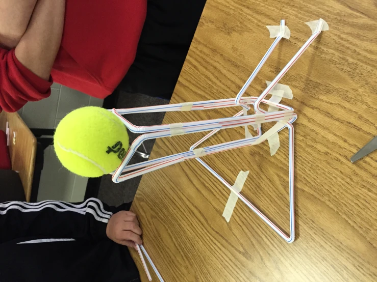 a tennis ball is in the middle of a structure