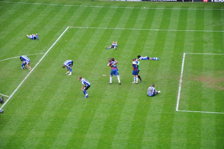 many young men play soccer in the field