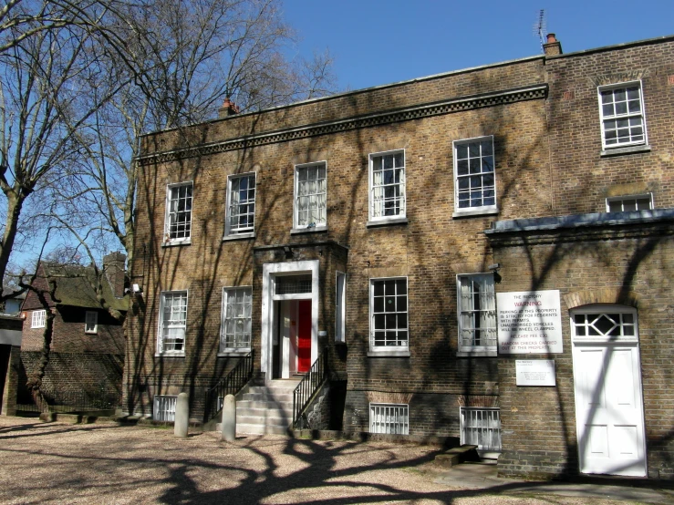 a brick building with several doors and windows