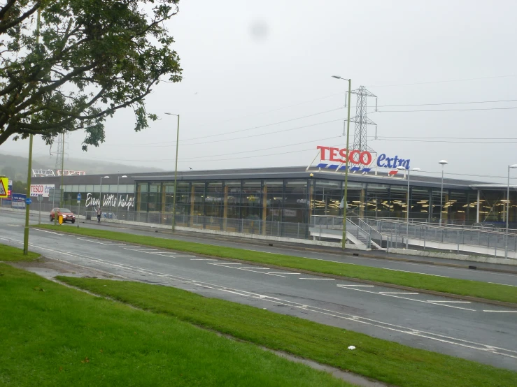 a road that runs between two large building