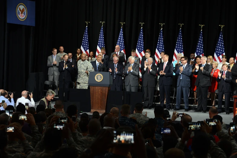 military ceremony with many people and their cell phones