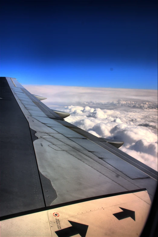 wing view from inside of an airplane on a clear day