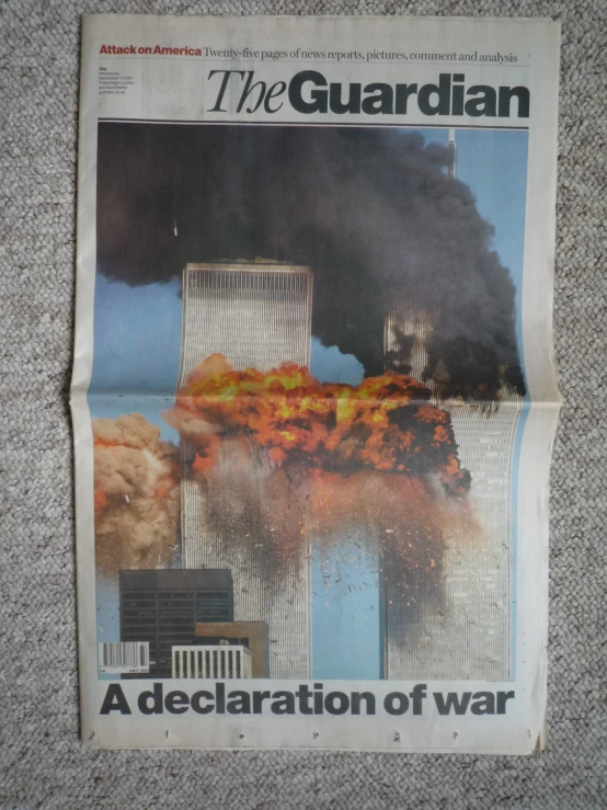 a newspaper with a large building and fire