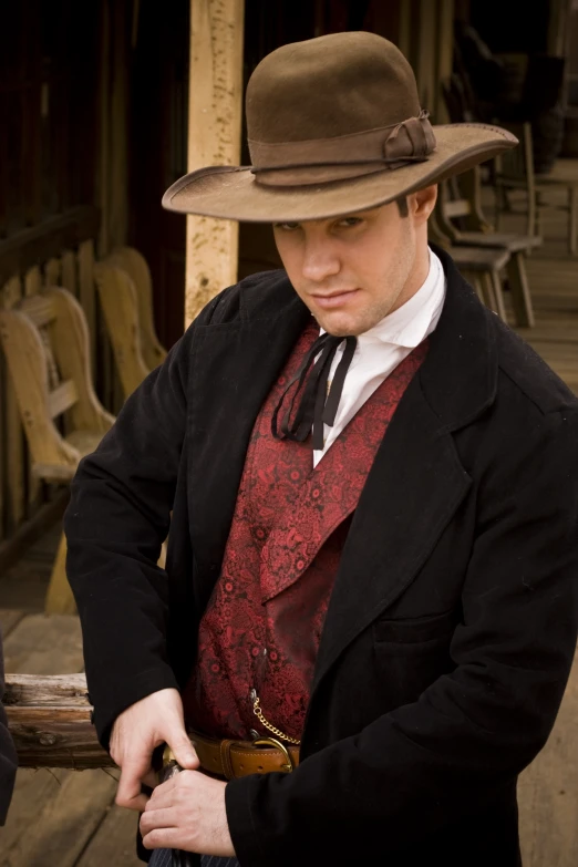 man in jacket and hat is wearing a vest