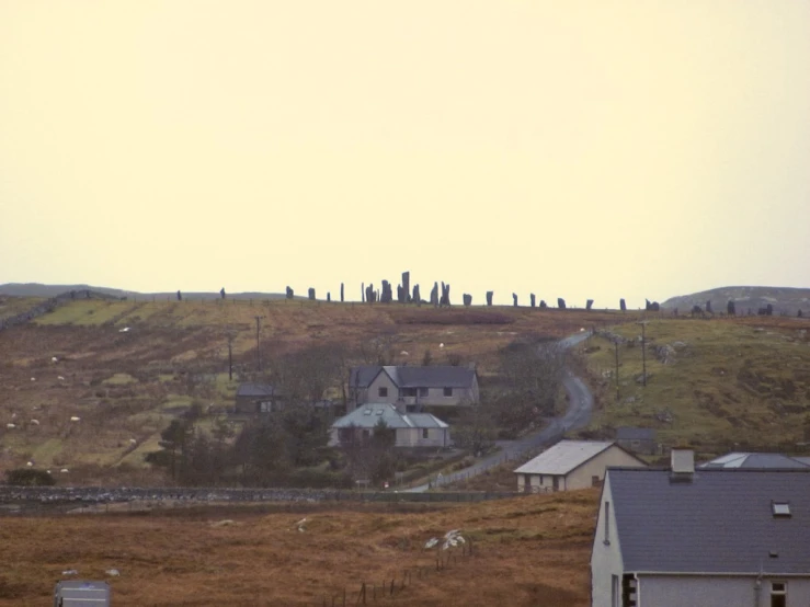 a house sitting on top of a hill