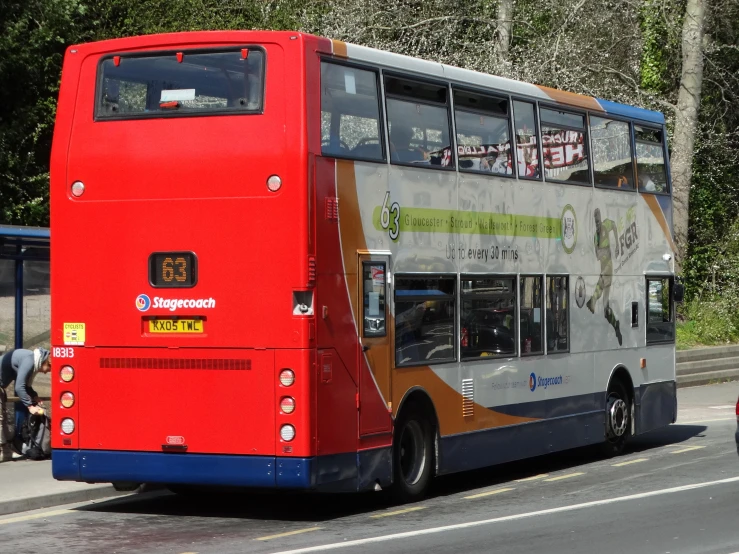 a double decker bus parked on the side of the road