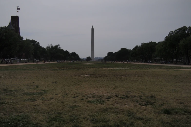 the washington monument is surrounded by several green trees