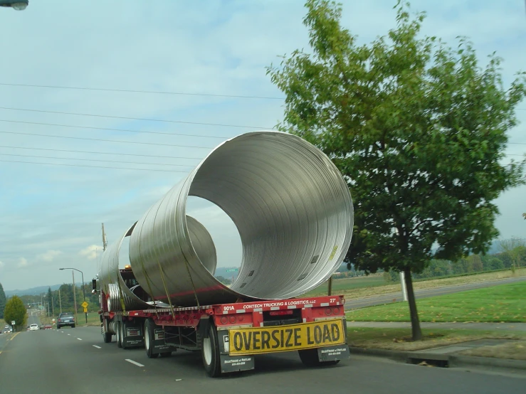a large metal container sitting on the back of a truck