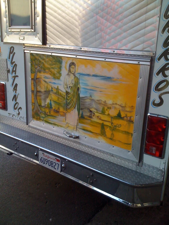 the back of a bus with pictures on it