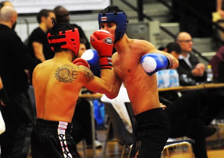 two men fighting with each other during a competitive event